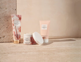 Victoria's Secret lotion next to fragrance mist to show layering benefit