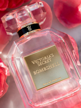 Victoria's Secret Bombshell fragrance wash pouring from bottle for fragranced cleansing