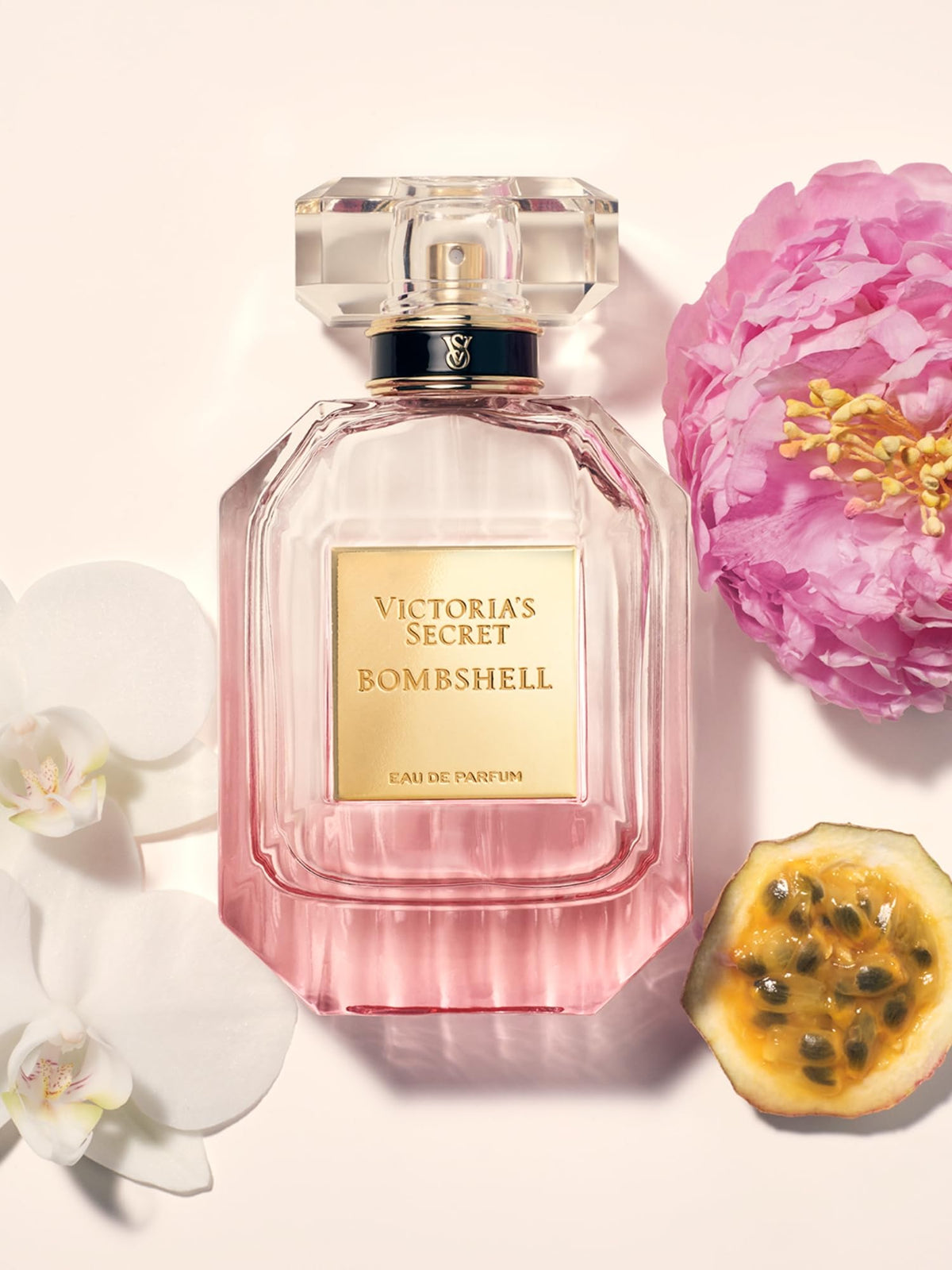 Victoria's Secret Bombshell shimmer mist spraying on wrist to refresh scent quickly