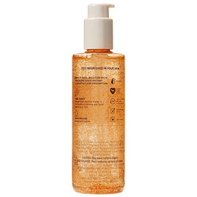 Victoria's Secret applying oil to arm highlighting easy massage and quick moisturize benefit