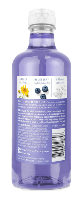 Village Naturals Therapy bottle closeup label highlighting ingredients and clarity