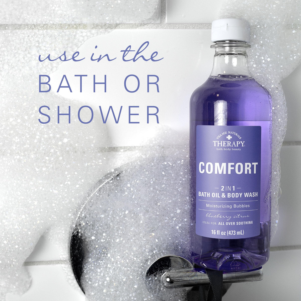 Village Naturals Therapy bottle placed by bathtub for relaxing at-home spa benefit