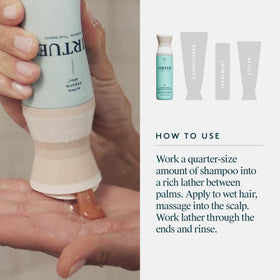 VIRTUE bottle next to hand for size comparison and travel-friendly benefit