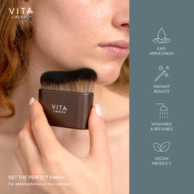 VITA LIBERATA brush next to hand showing scale and controlled application benefit