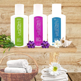 Vitabath bottle in styled bathroom scene promoting spa-like feel