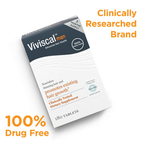 Man using Viviscal while grooming to support confident hair appearance
