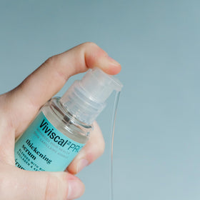 Viviscal close-up of elixir texture on pipette, highlights lightweight absorption