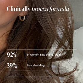 Viviscal tablets in hand to show actual size and convenient portability benefit