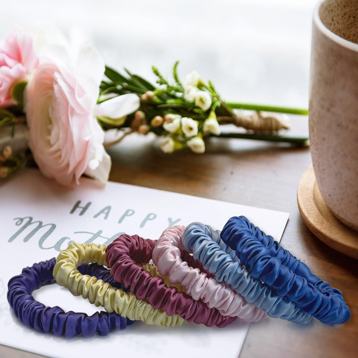 VLOMOT scrunchie beside coin showing compact size and easy storage