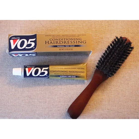 VO5 being applied to wet hair in shower for easier detangling