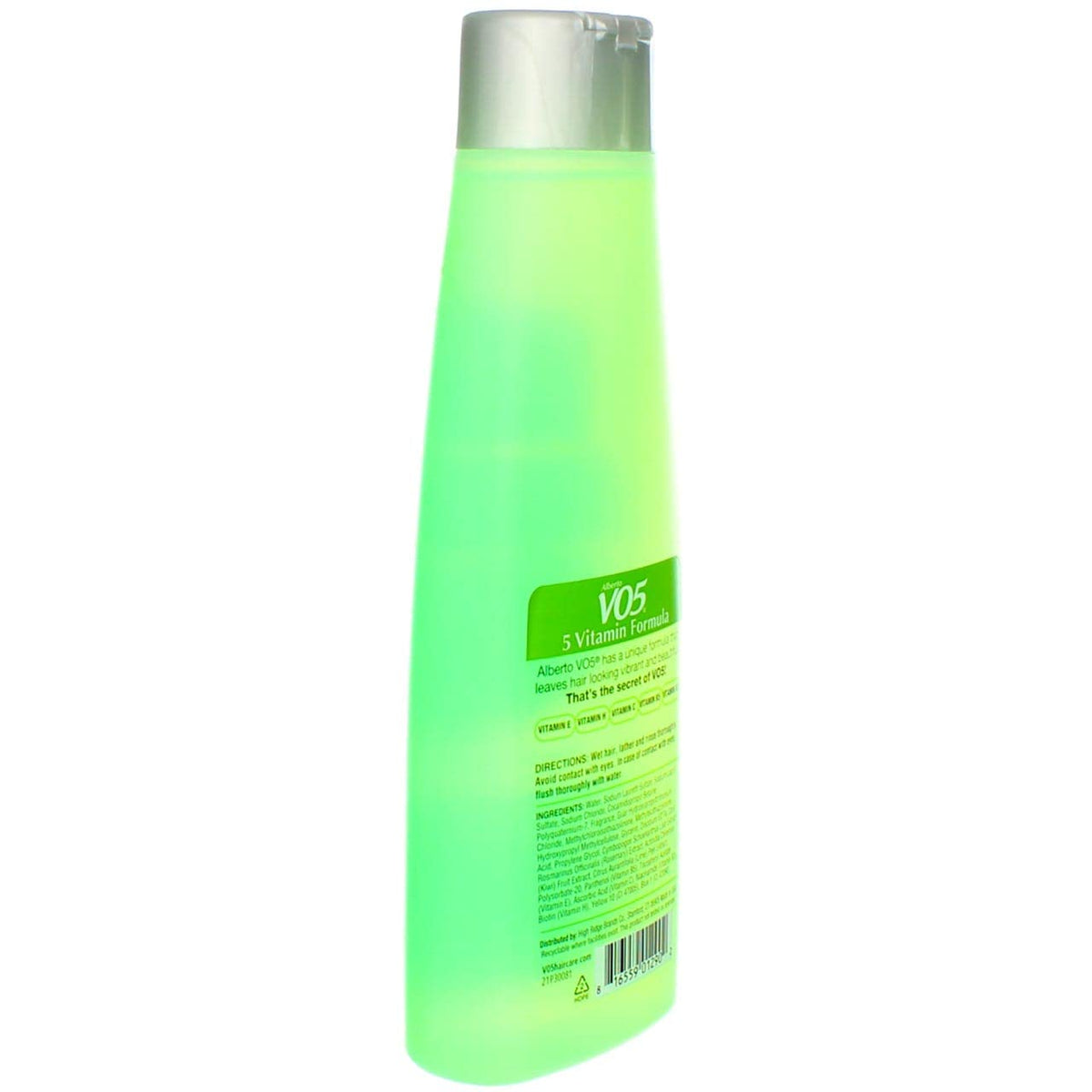 VO5 bottle beside kiwi and lime suggesting fresh citrus fragrance