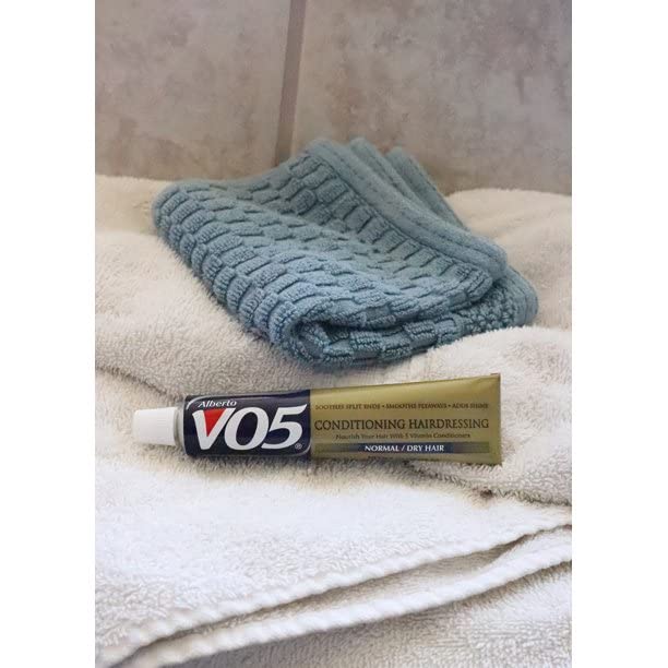 VO5 four-bottle pack staged for travel and repeated use