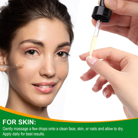 VXHDAG brushing Batana oil onto brows and lashes for fuller appearance