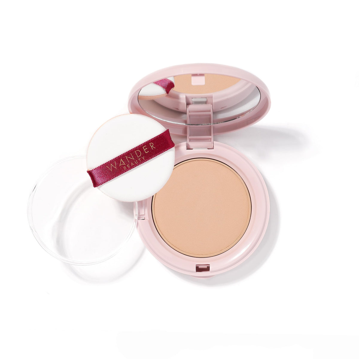 Wander Beauty front compact showing product packaging and shade
