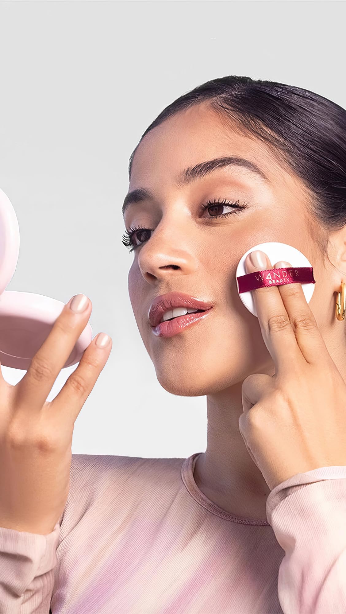 Wander Beauty powder applied on skin demonstrating matte natural finish