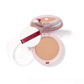 Wander Beauty compact front showing product branding and slim design benefit