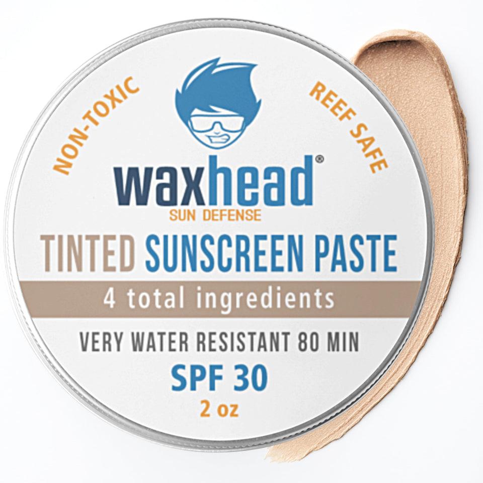 Waxhead front tin showing product branding and travel tin benefit