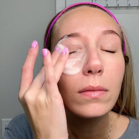 We Love Eyes bottle next to coin to show size and travel-friendly benefit