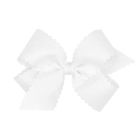 Wee Ones close-up scalloped edge detail highlighting refined trim and textured ribbon