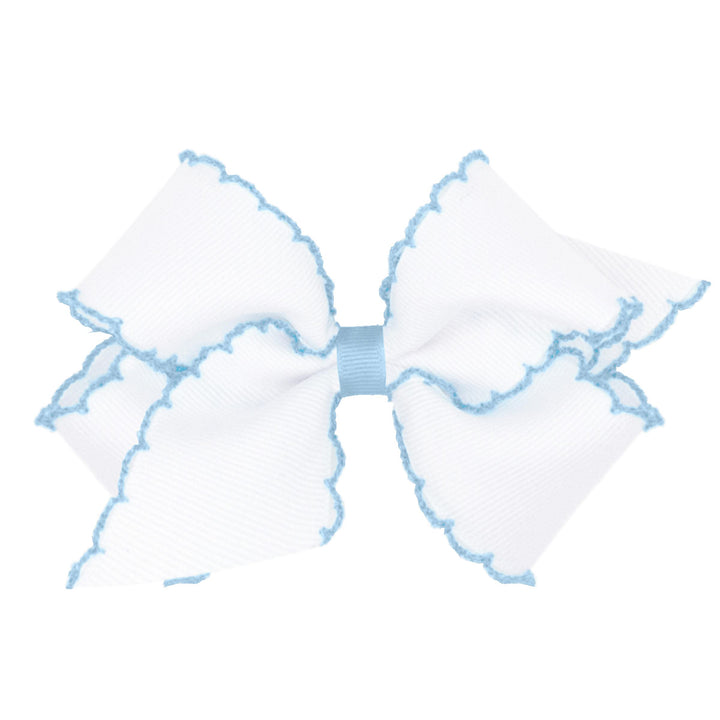 Wee Ones front view of white with blue medium grosgrain bow showing polished look
