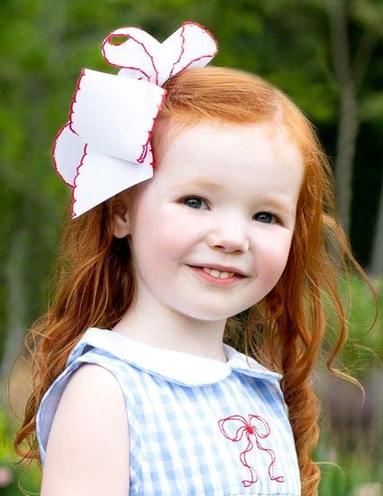 Wee Ones child wearing bow demonstrating comfortable all-day wear