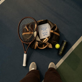 Welaroise travel pouch beside passport emphasizing portability