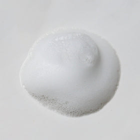 Weleda gentle cleansing foam bottle on bathroom counter suggests daily skincare routine