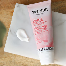Weleda ingredient layout with jojoba borage coconut emphasizing plant-based nourishment