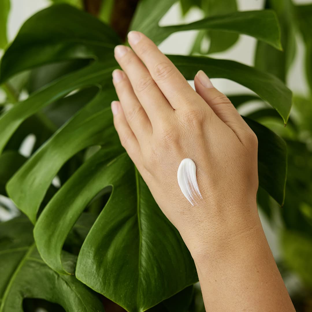Weleda tube next to smartphone showing 1.7 fl oz size for easy portability