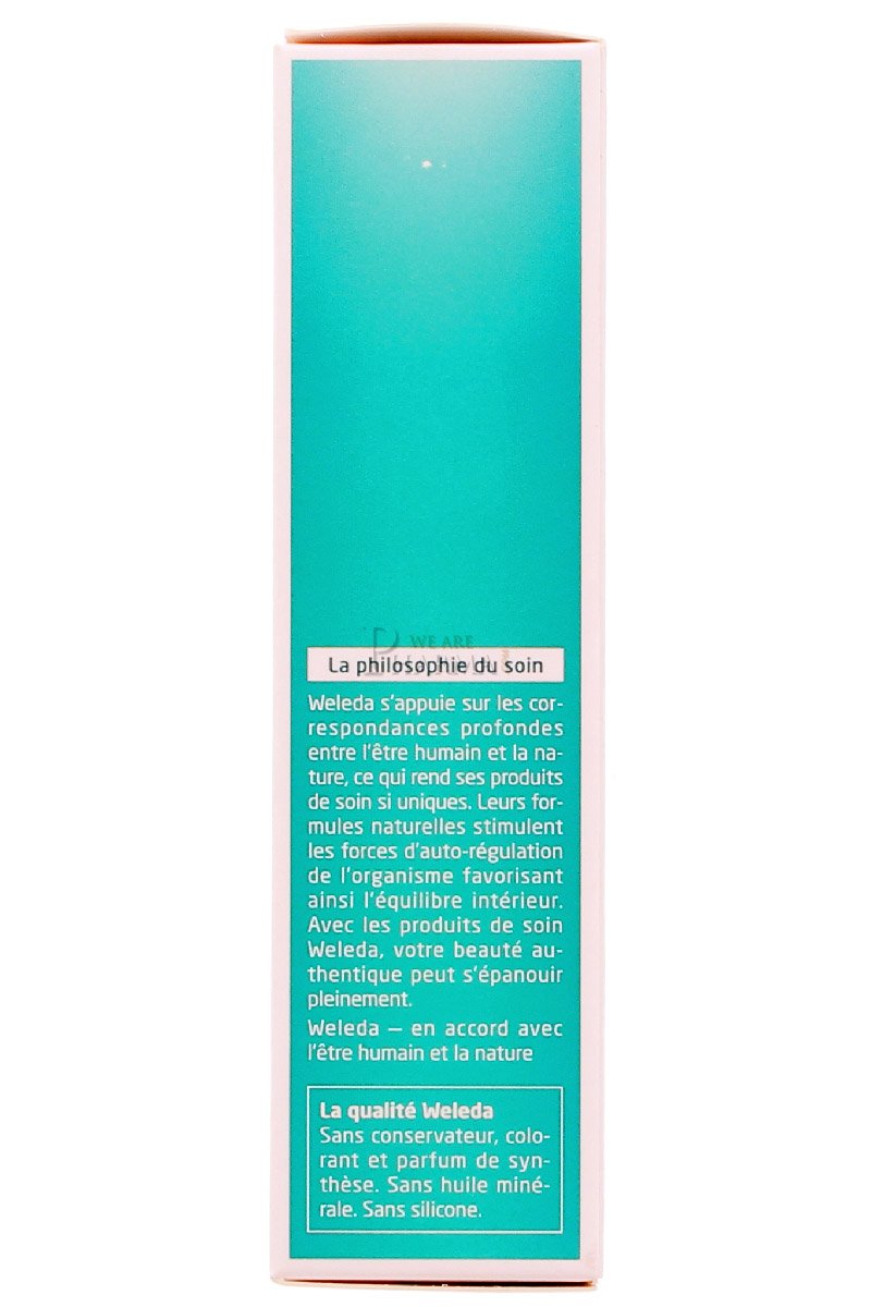 Applying Weleda rosemary tonic to scalp showing easy spray and quick absorption benefit