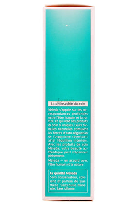 Applying Weleda rosemary tonic to scalp showing easy spray and quick absorption benefit
