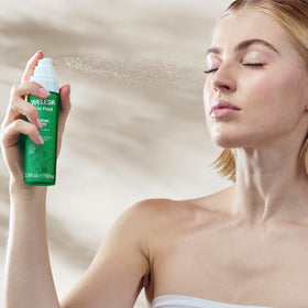 Weleda Skin Food mist size comparison in hand showing travel-ready, recycled packaging