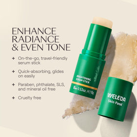 Weleda Skin Food stick beside passport and sunglasses highlighting on-the-go use