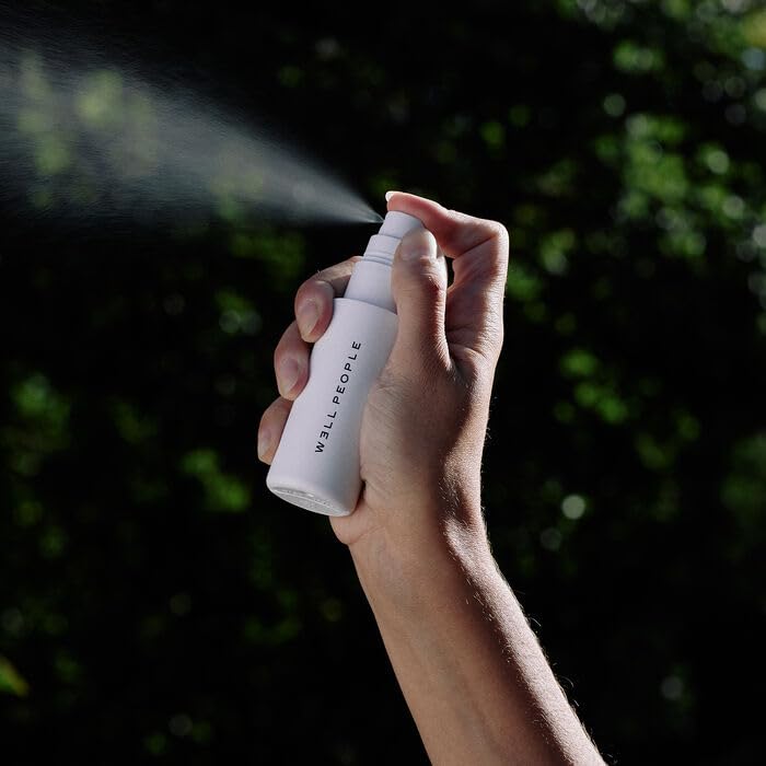 Well People mist spraying fine veil demonstrating quick application and even coverage