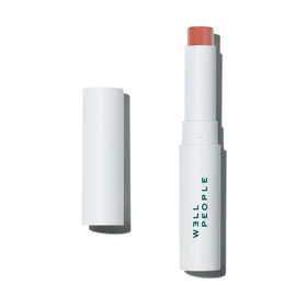 Well People front packaging showing peach tinted lip butter and SPF protection benefit