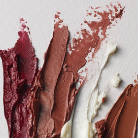 Well People ingredients flatlay with plant oils showing natural formulation