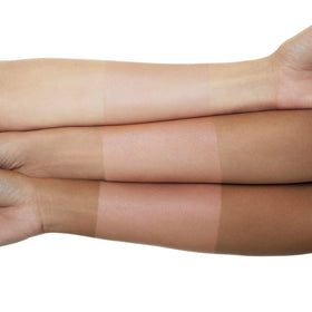 Well People brush applying powder to compact demonstrating smooth application and blur