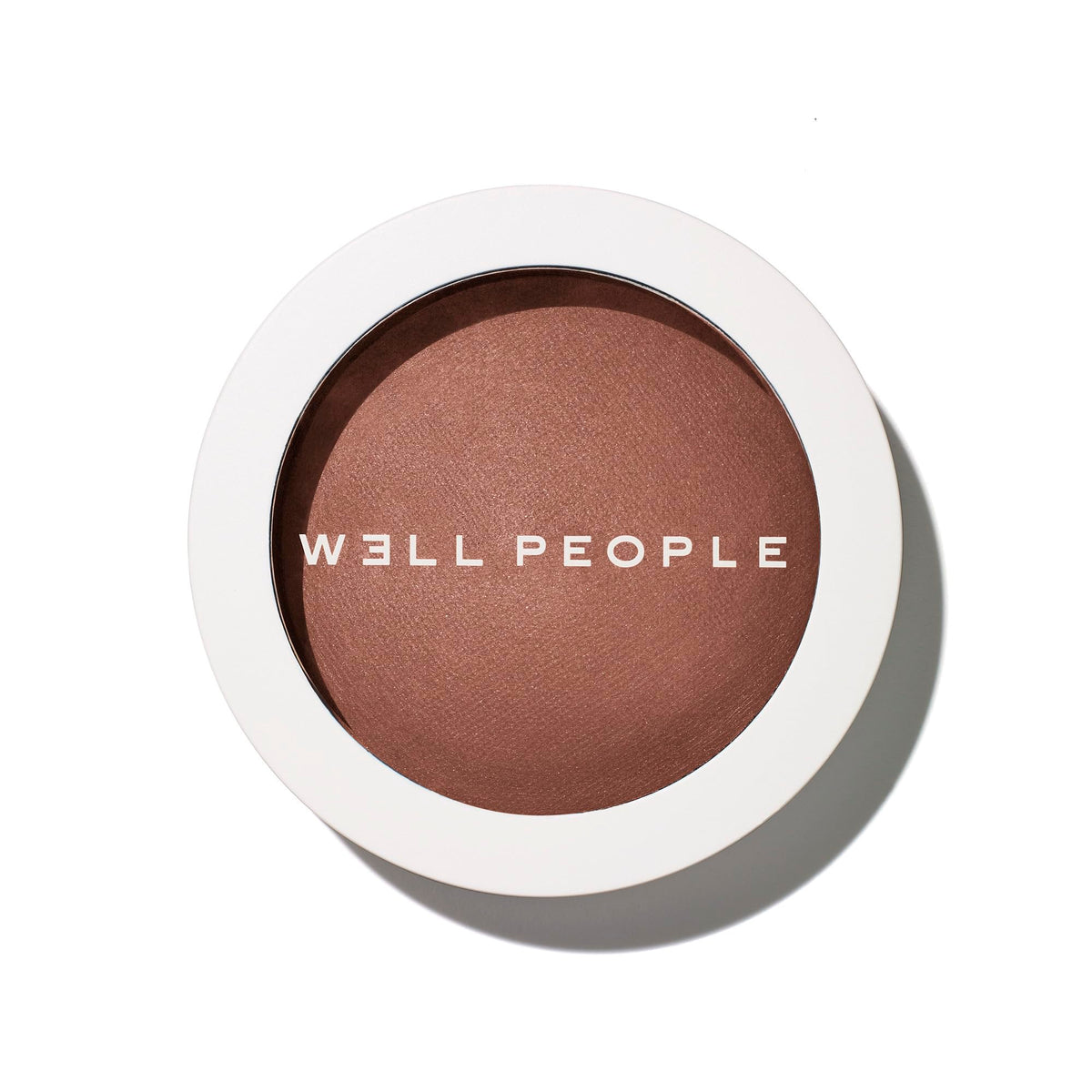 Well People compact front view showing bronzer shade and packaging benefit