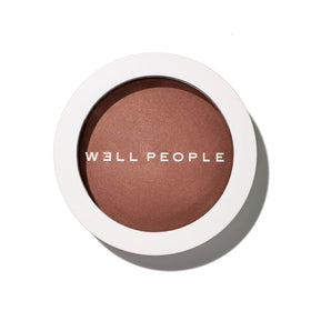 Well People compact front view showing bronzer shade and packaging benefit