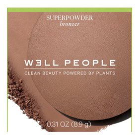 Well People bronzer next to a coin for size comparison and portable benefit