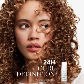 Wella Professionals Nutricurls balm texture close-up highlighting creamy consistency for smooth application