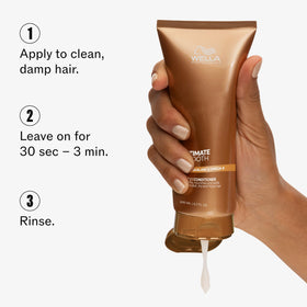 Wella Professionals 2.5 fl oz bottle in hand showing travel-friendly size