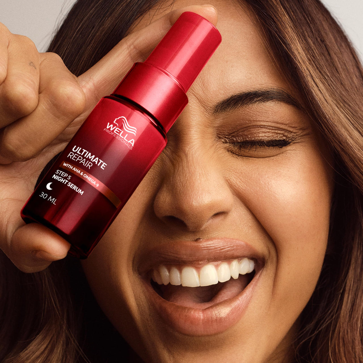 Wella Professionals product label highlighting AHA and Omega-9 technology benefits