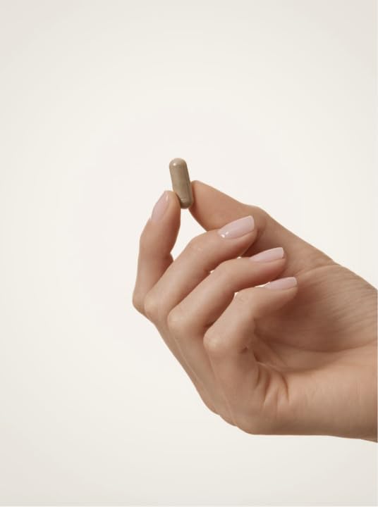 WELLBEL bottle held in hand to show scale and 90-count supply size