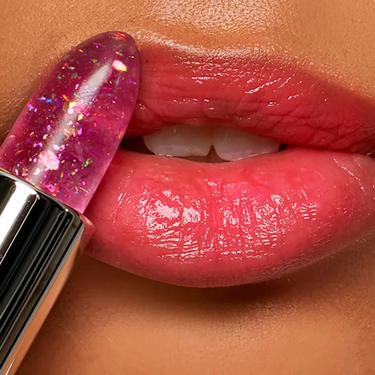 Winky Lux applied on lips showing personalized pink tint and natural sheen