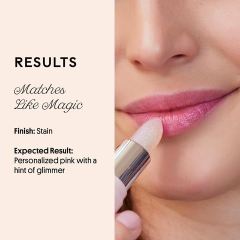 Winky Lux balm applied on lips exhibiting sheer pink tint and luminous finish