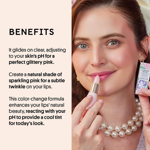 Winky Lux balms in hand for scale, showing travel-friendly size and convenience