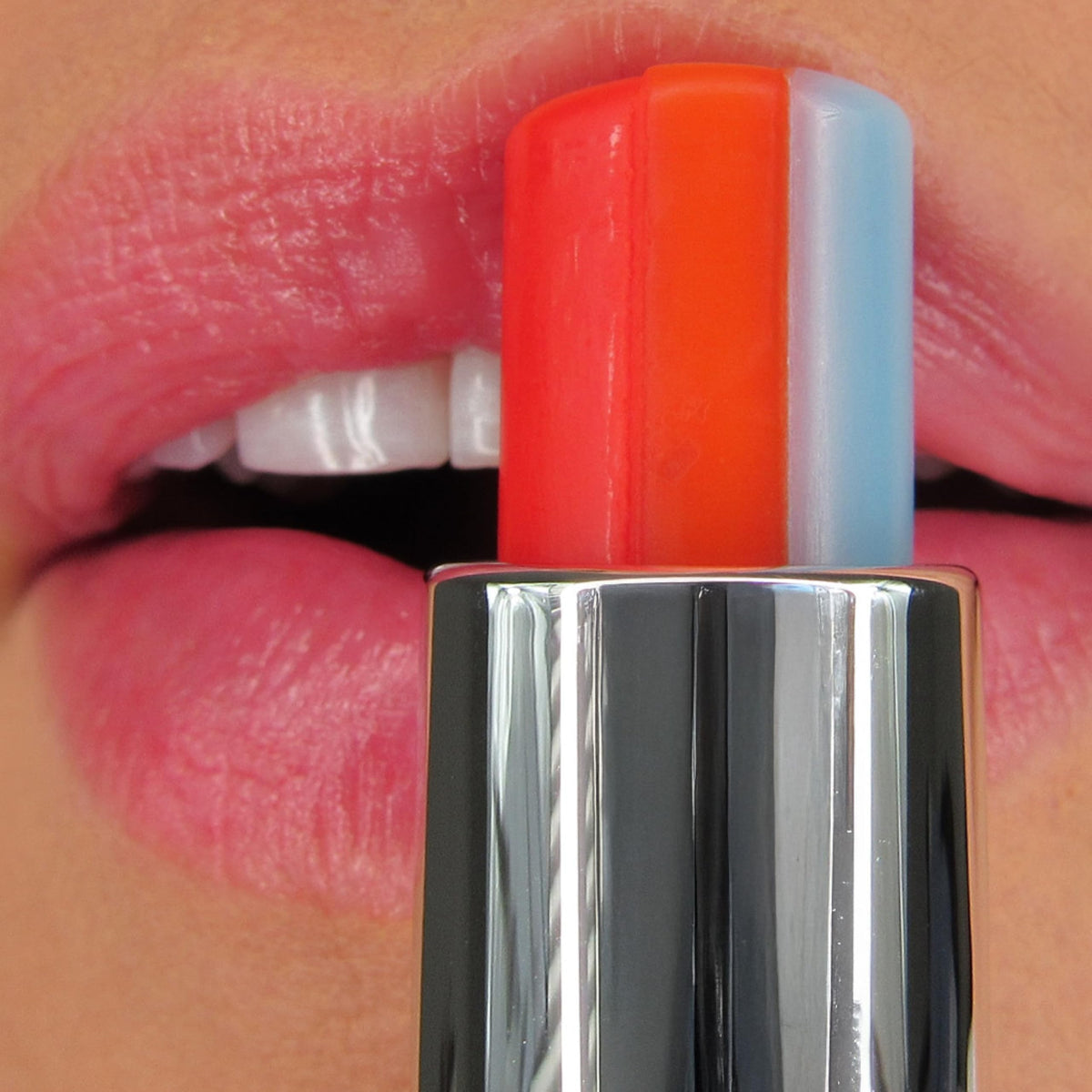 Winky Lux lip swatch on hand showing sheer pink tint and comfortable shine