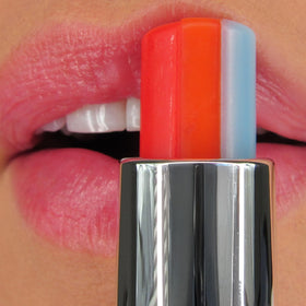 Winky Lux lip swatch on hand showing sheer pink tint and comfortable shine