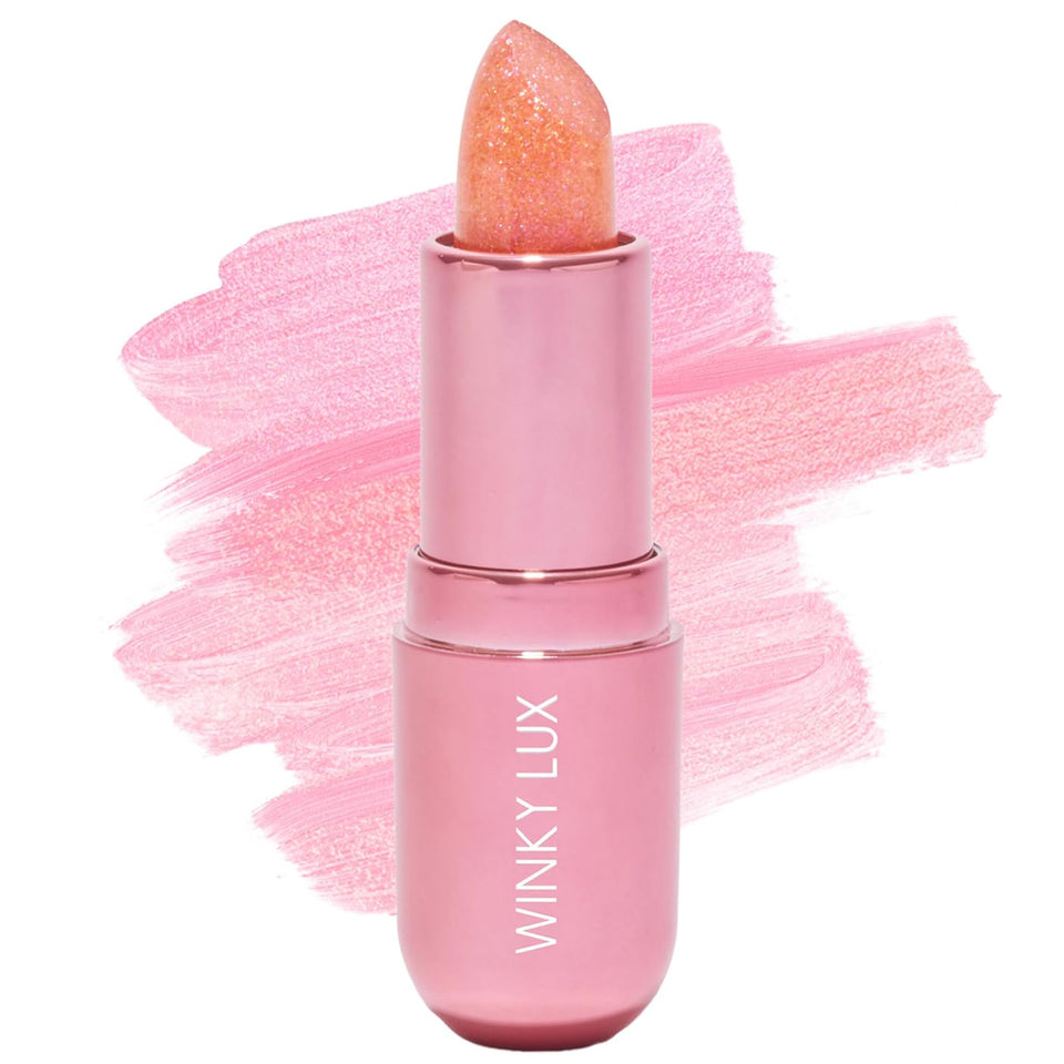 Winky Lux front packaging showcasing compact jewel balm and playful branding benefits